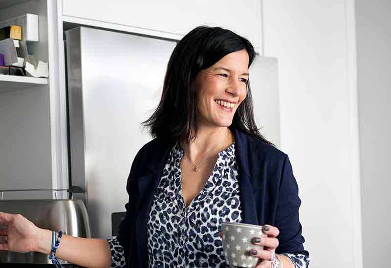 Woman holding mug